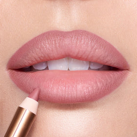 Charlotte Tilbury lip liner applied to lips in use illustrating fuller-looking, natural result