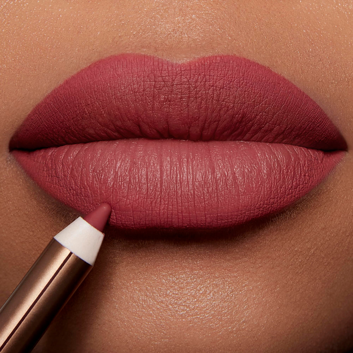 Charlotte Tilbury Lip Cheat texture with jojoba oil illustrating moisturized finish