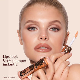 Charlotte Tilbury gloss worn on model showing instant plumper-looking, jewel-glazed lips