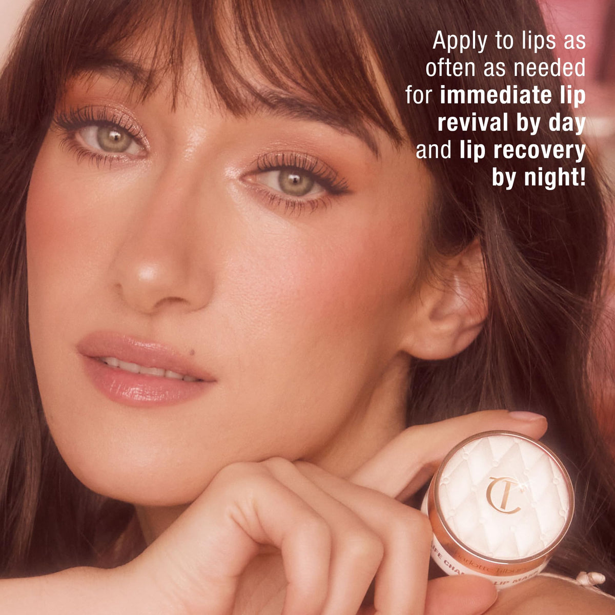 Charlotte Tilbury lip mask applied on lips closeup giving a soft pink glow and smoother look