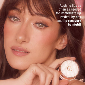 Charlotte Tilbury lip mask applied on lips closeup giving a soft pink glow and smoother look