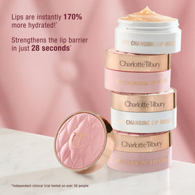 Charlotte Tilbury jar next to a coin to show compact travel-friendly size and portability