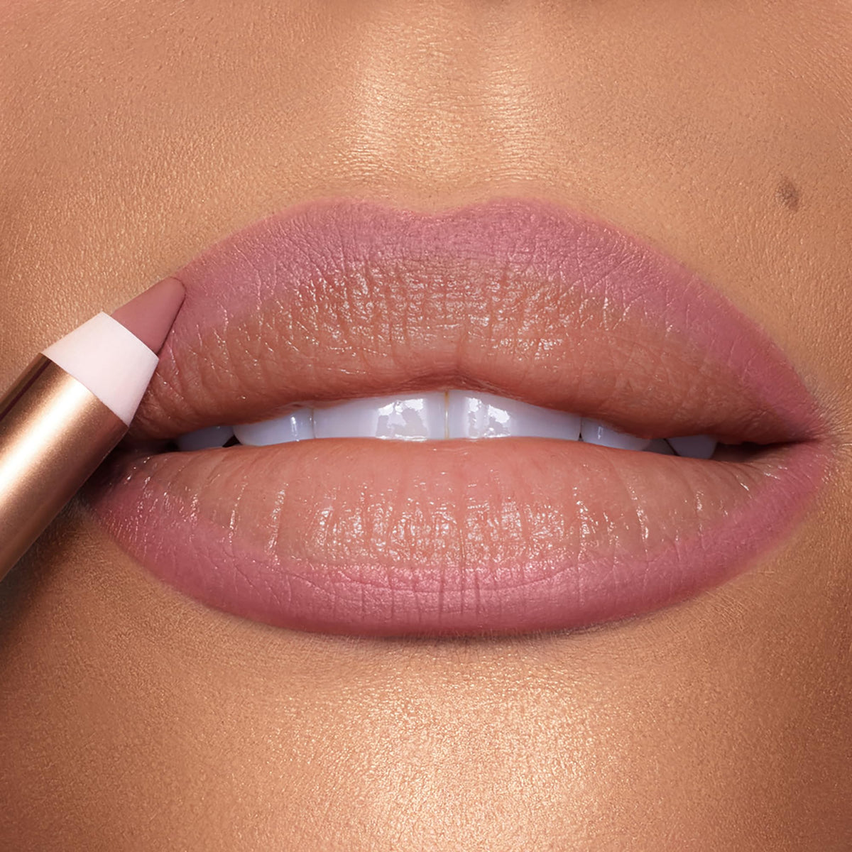 Charlotte Tilbury drawing a clean lipline to show precise definition