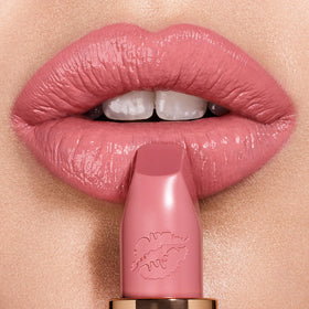 Charlotte Tilbury Liv It Up bullet close-up highlighting satin finish benefit