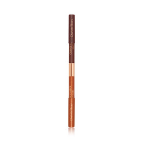 Charlotte Tilbury pencil beside ruler demonstrating compact size and convenient portability
