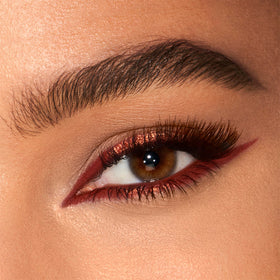 Charlotte Tilbury swatch showing creamy copper texture and blendability for visible dimension