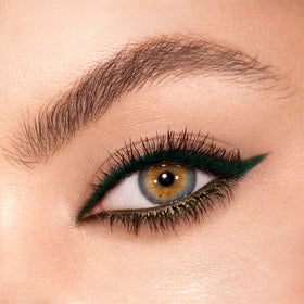 Charlotte Tilbury Magic Eyeliner swatches on skin showing matte and metallic contrast benefits