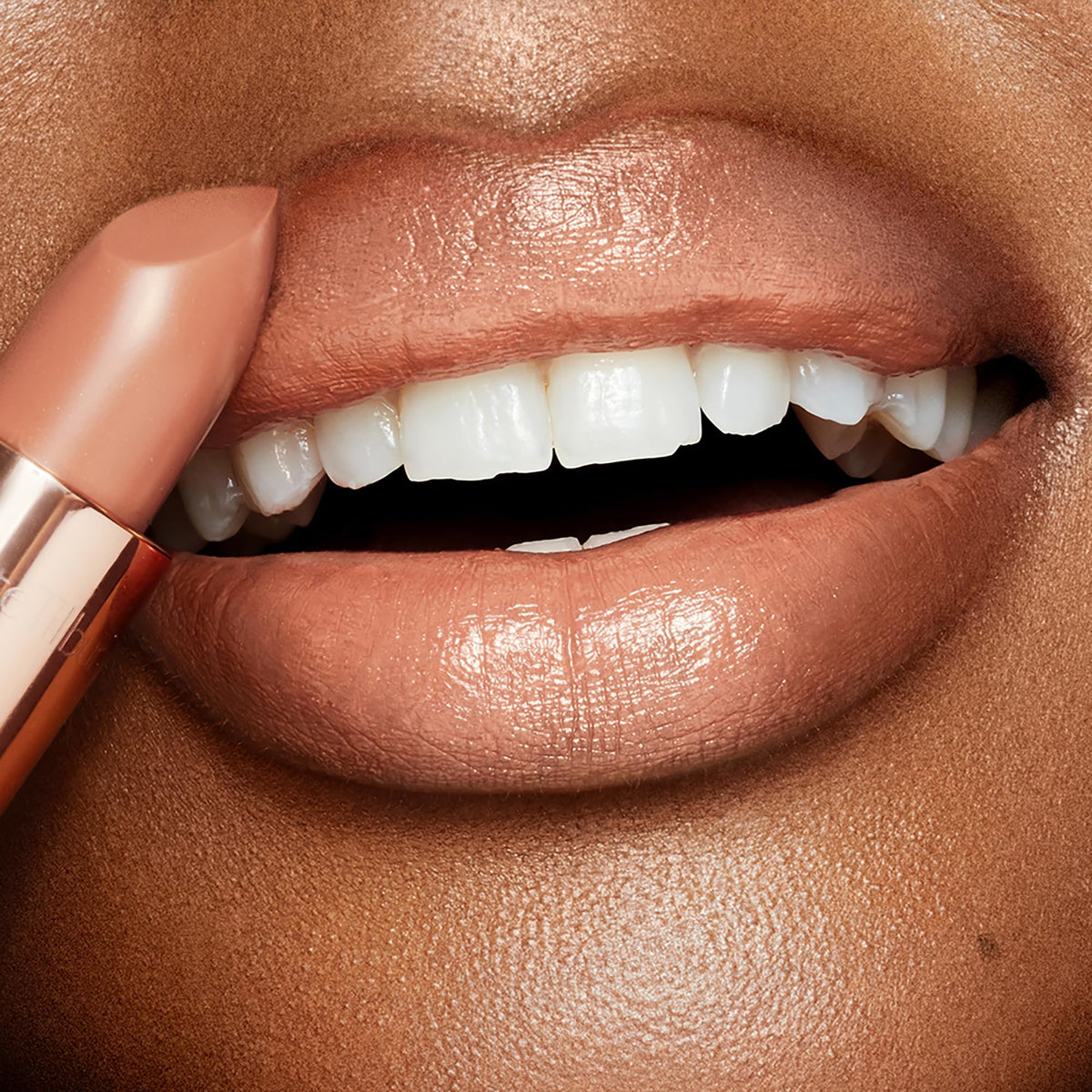 Charlotte Tilbury Nude Kate swatch showing smooth texture and light-diffusing glow