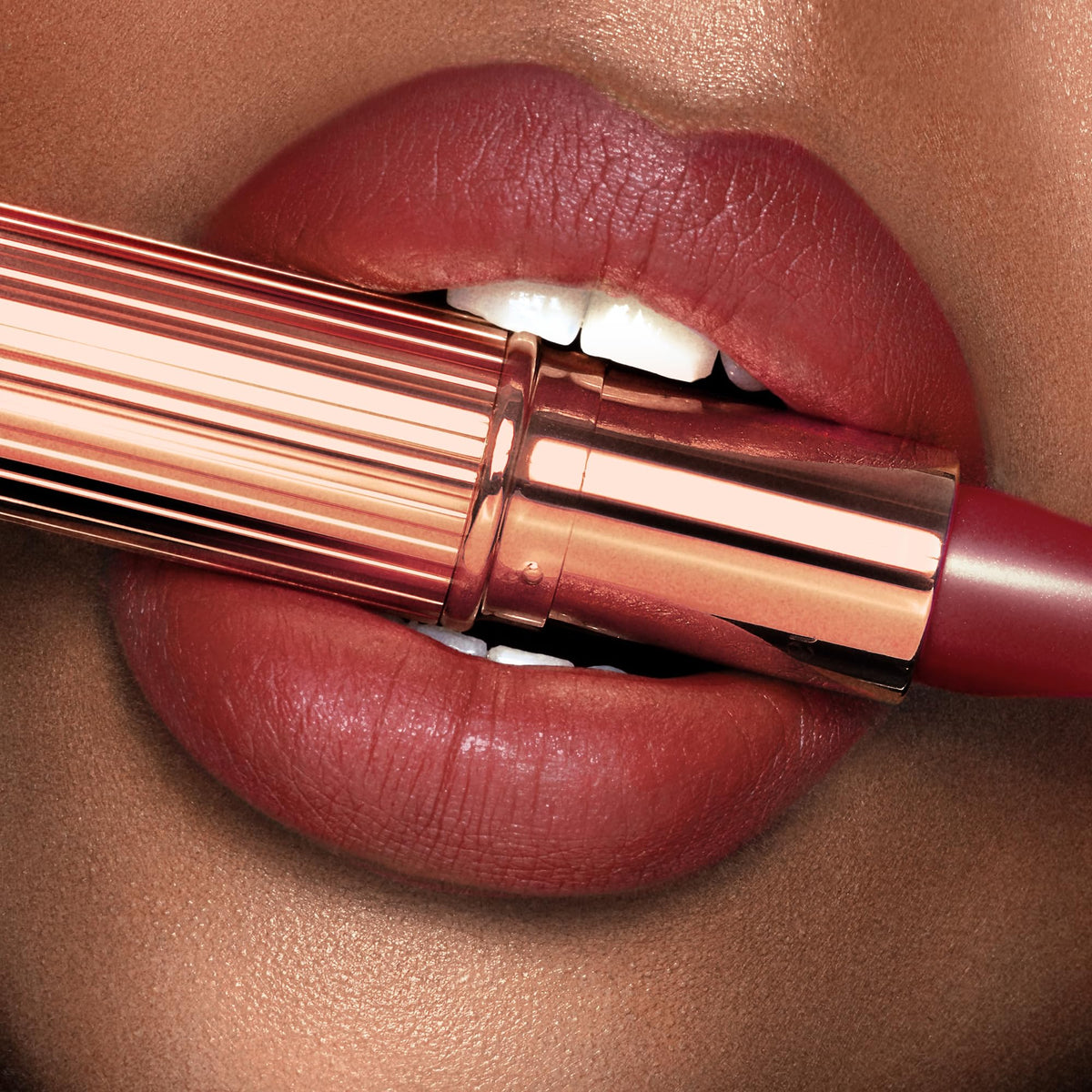 Charlotte Tilbury opened tube with cap highlighting sleek design and travel convenience