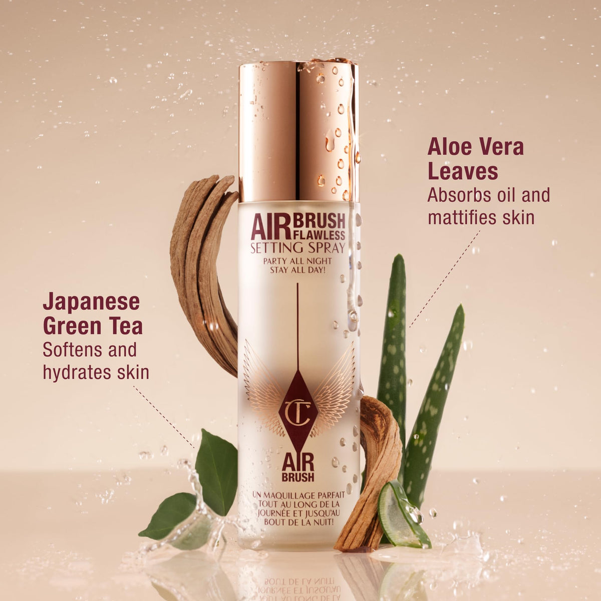 Charlotte Tilbury spray beside makeup kit illustrating compatibility with cosmetics