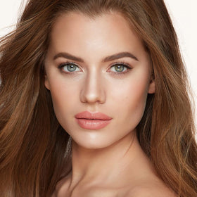 Charlotte Tilbury palette placed in a makeup bag for everyday portability and convenience
