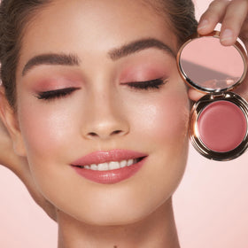 Charlotte Tilbury product applied on cheek for a natural flush, easy fingertip blending benefit
