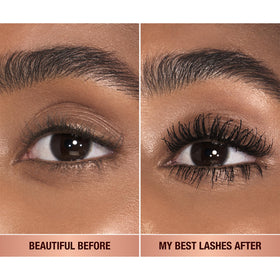 Charlotte Tilbury wand pulled from tube highlighting brush end for precise application benefit