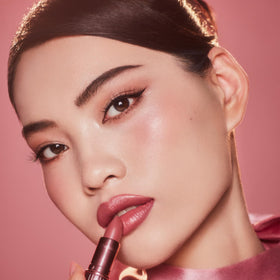 Charlotte Tilbury Rose to Fame tube open detail showing lipstick form and easy application benefit