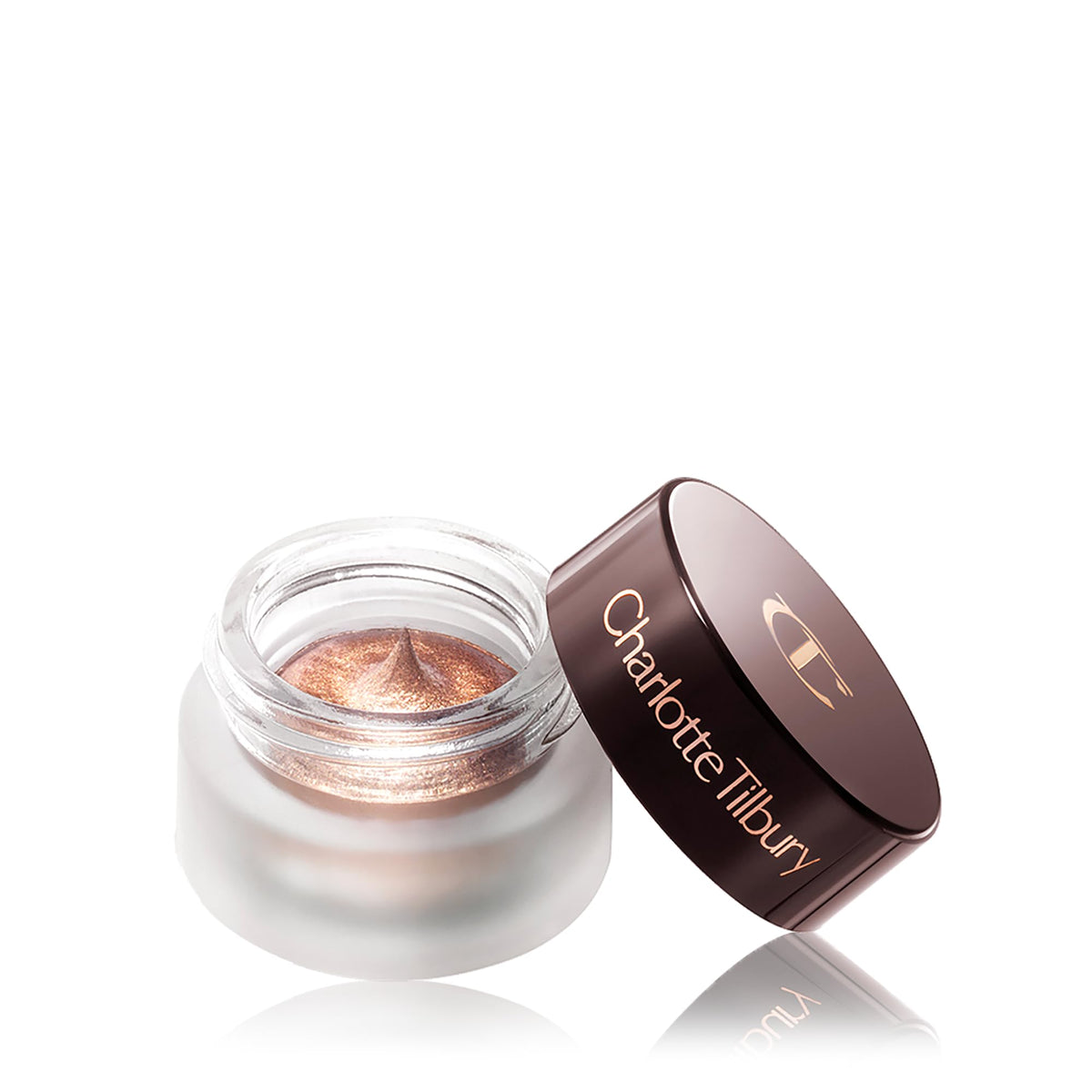 Charlotte Tilbury 7ml pot held in hand showing compact travel-friendly size