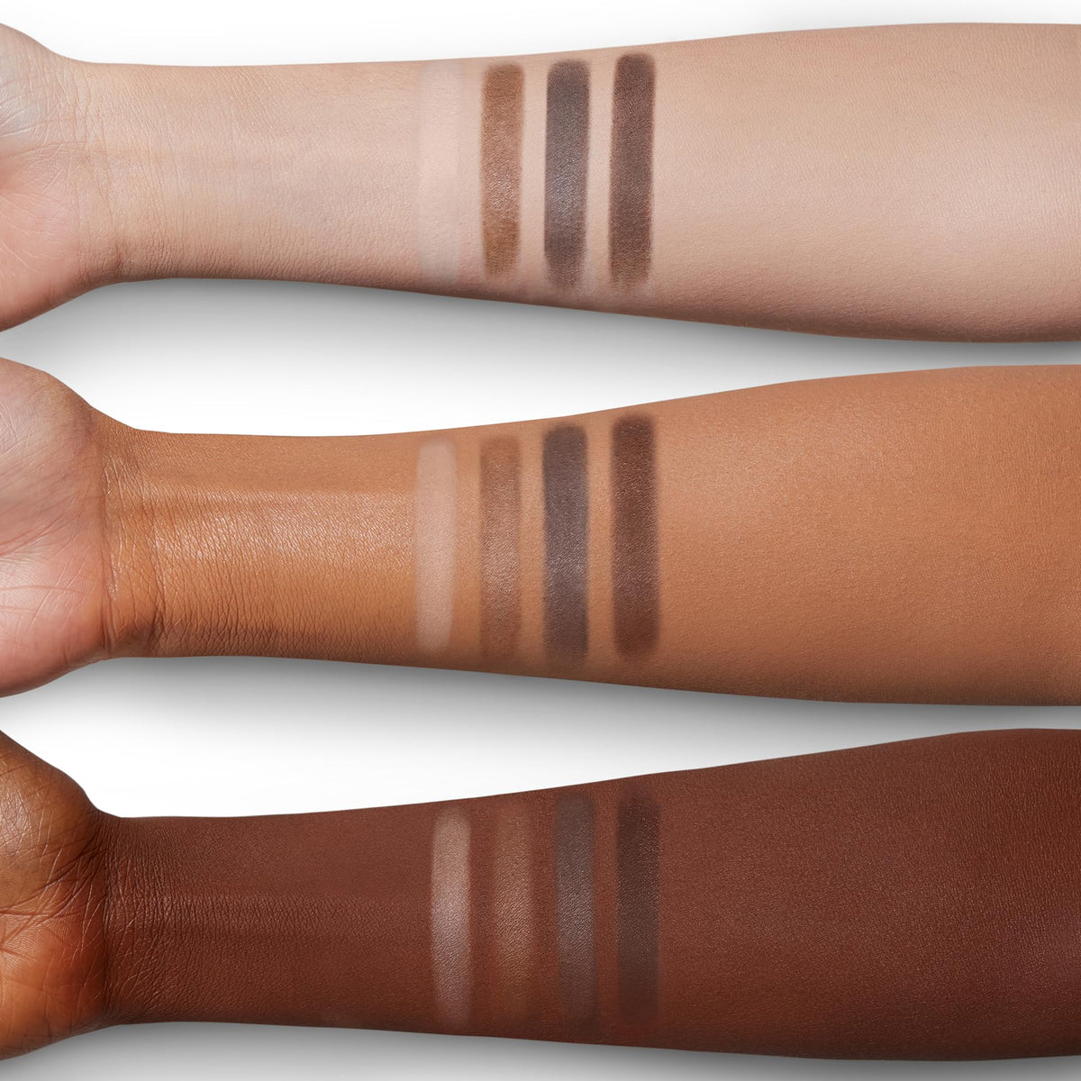 Charlotte Tilbury palette scale next to hand showing compact size for travel convenience