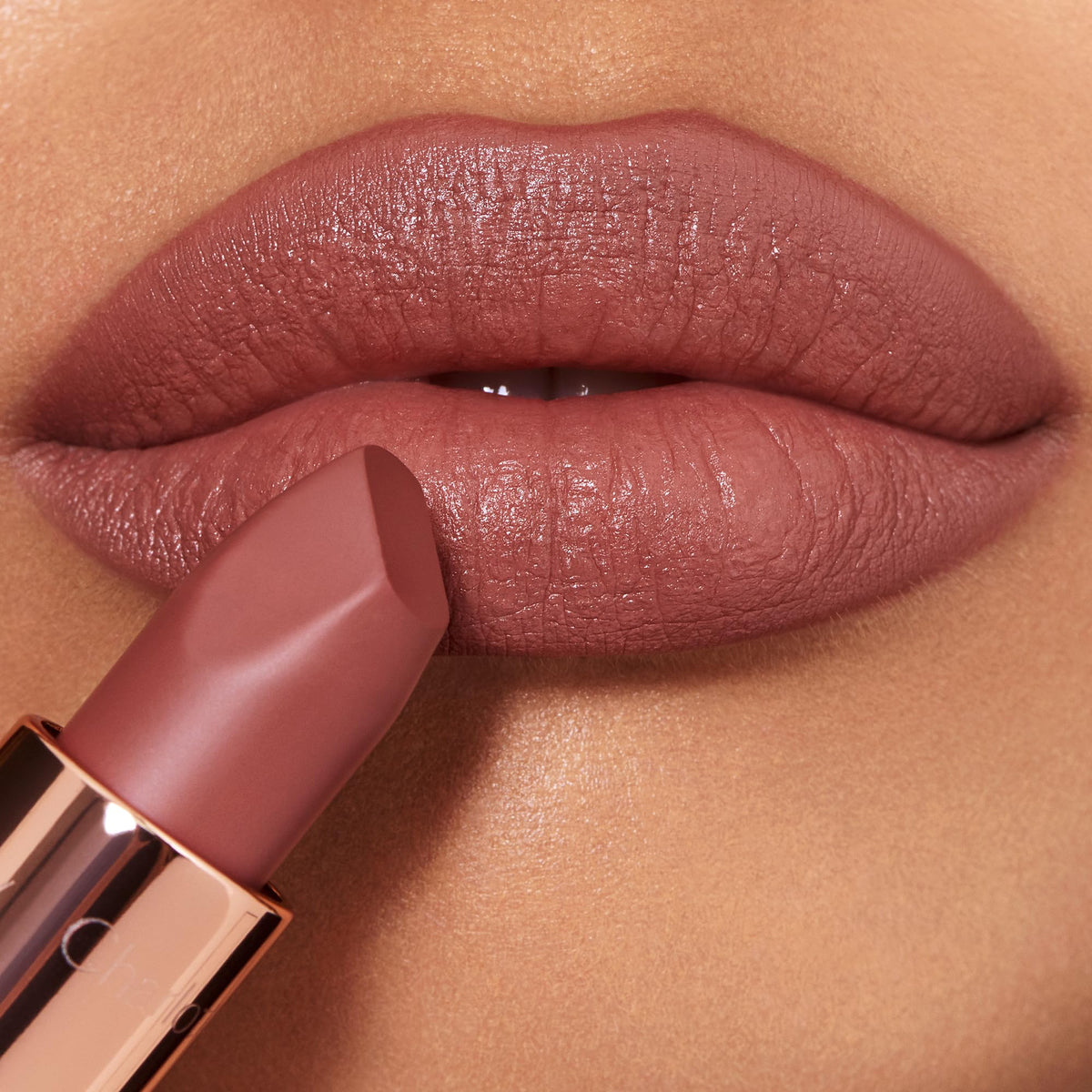 Charlotte Tilbury Supermodel held in hand to show true size and easy portability benefit