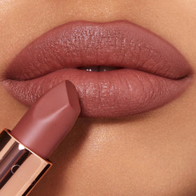 Charlotte Tilbury Supermodel held in hand to show true size and easy portability benefit