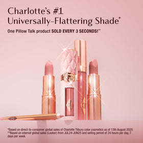 Charlotte Tilbury swatch on forearm illustrating buildable Pillow Talk color