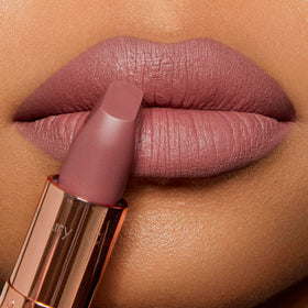 Charlotte Tilbury lip swatch on skin demonstrating Very Victoria taupe-nude flattering tone