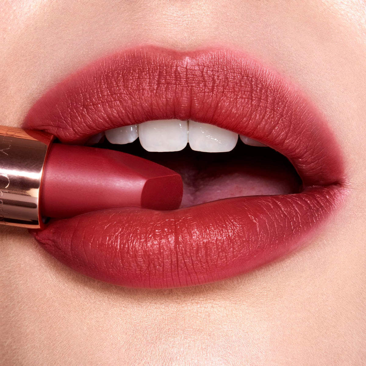Charlotte Tilbury Walk Of No Shame on model lips highlighting flattering berry-rose