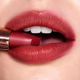 Charlotte Tilbury Walk Of No Shame on model lips highlighting flattering berry-rose