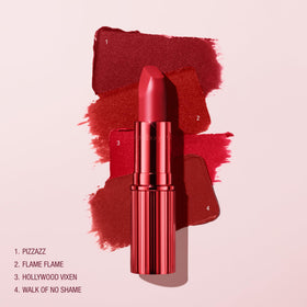 Charlotte Tilbury lipstick tucked inside a beauty bag suggesting giftable convenience