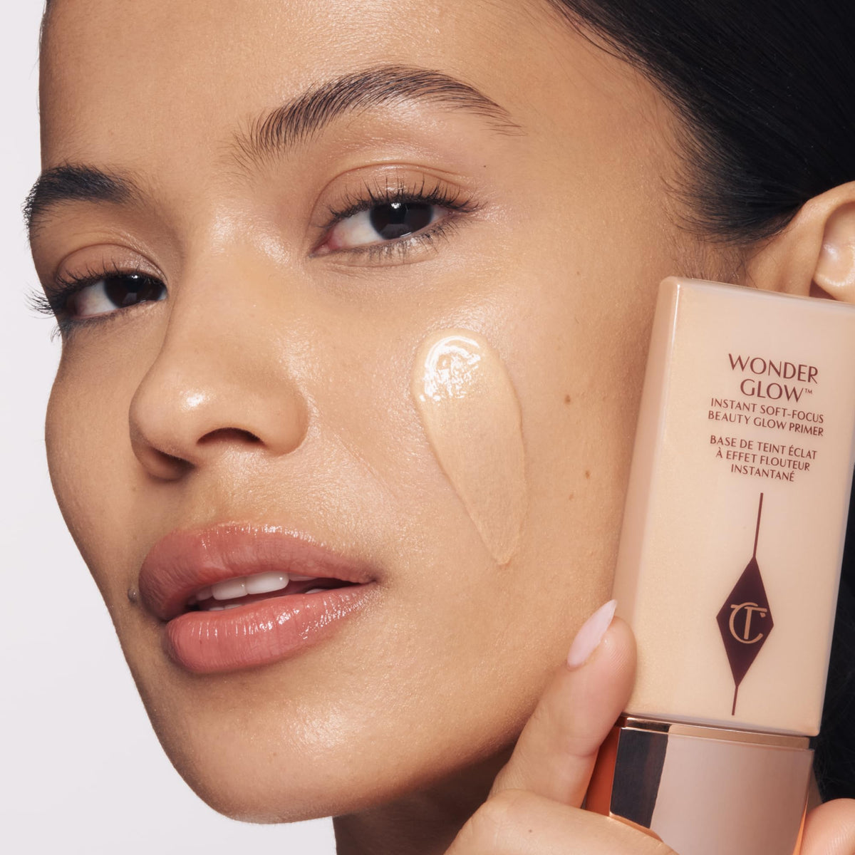 Charlotte Tilbury texture swipe showing creamy luminous primer and smooth finish