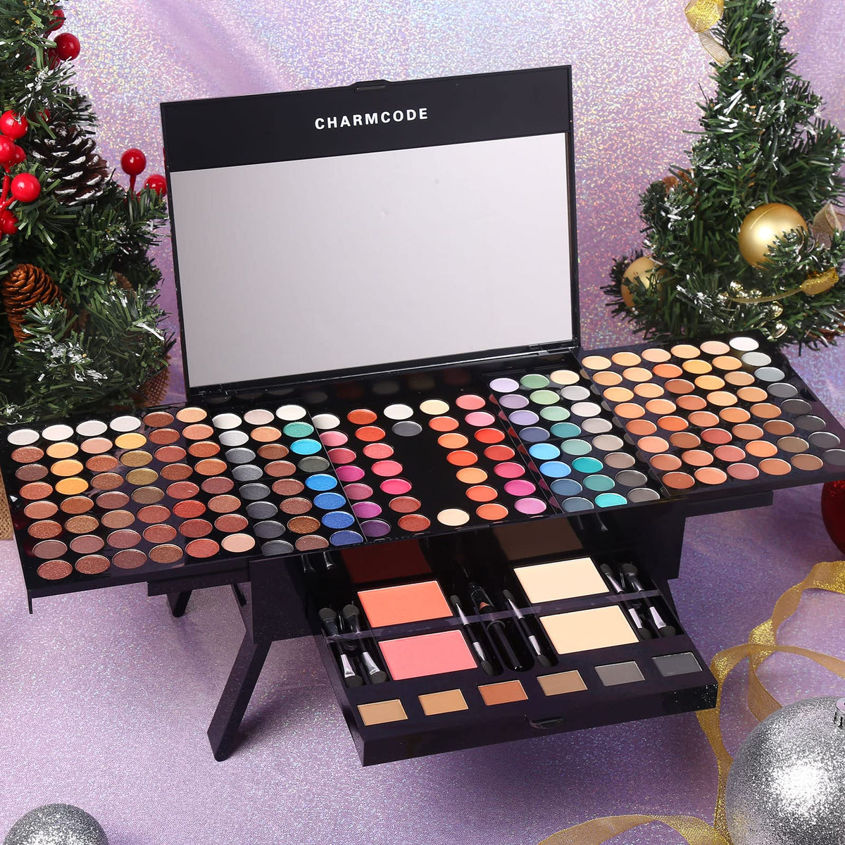 CHARMCODE palette held in hand to show compact scale and travel-friendly benefit