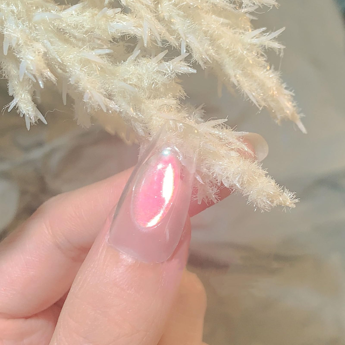 CHARMING MAY lifestyle manicure shot displaying iridescent nails suitable for events