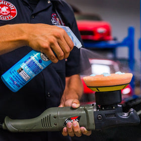 Chemical Guys pad conditioner in use on polisher to reduce friction and heat