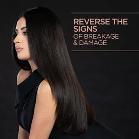 CHI applying oil to damp hair to improve moisture and manageability