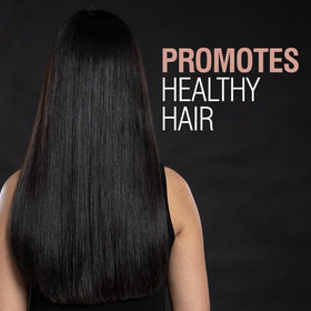 CHI being diffused into curly hair showing defined curls and enhanced shine