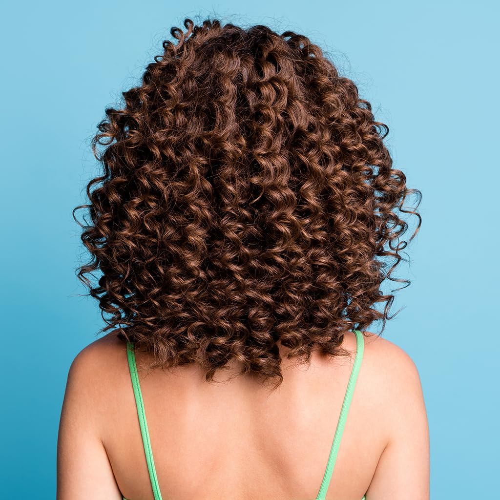 CHI styled beach curls in sunlit setting, emphasizes defined, frizz-free waves