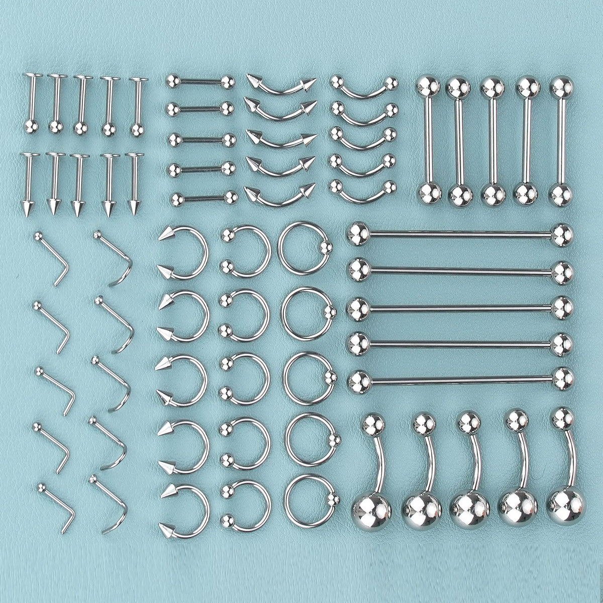 ChiMunllin flat lay of needles, gloves, clamps and alcohol pads for hygienic piercing prep