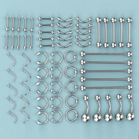 ChiMunllin flat lay of needles, gloves, clamps and alcohol pads for hygienic piercing prep