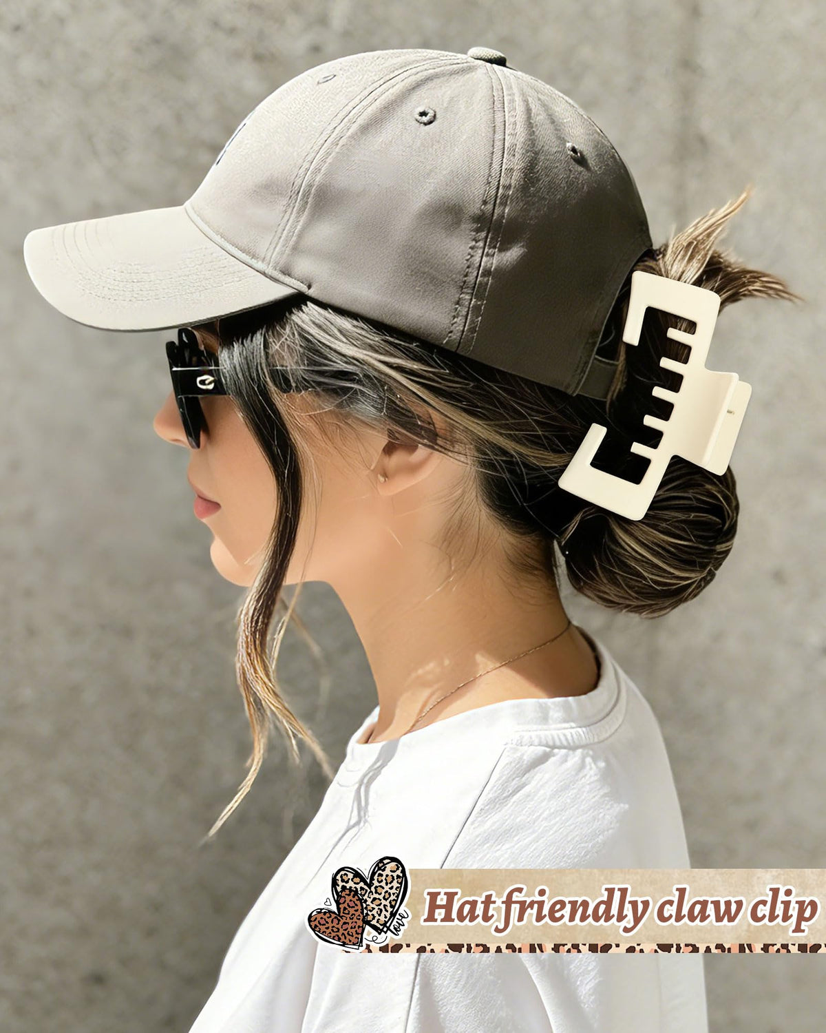 CHLINS clip holding a high ponytail while worn with a trucker hat