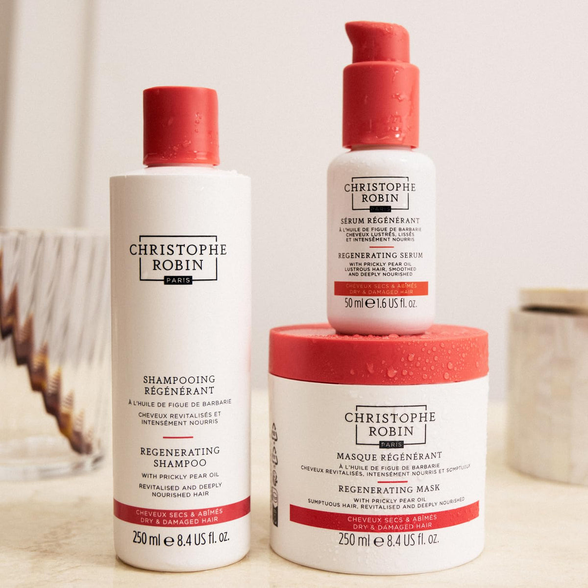 Christophe Robin on bathroom shelf in lifestyle scene suggesting indulgent at-home treatment benefit