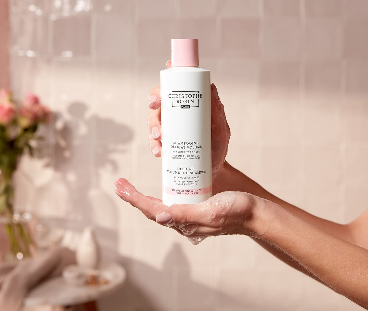Christophe Robin shampoo on bathroom shelf suggesting salon-style routine