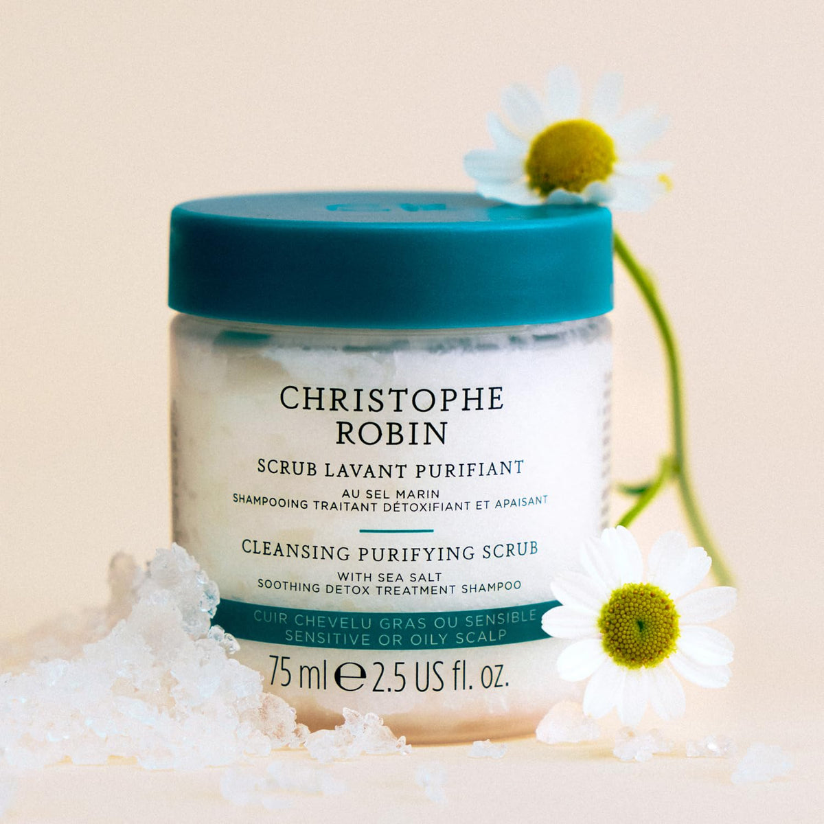 Christophe Robin scrub being applied to scalp demonstrating gentle massage and detox