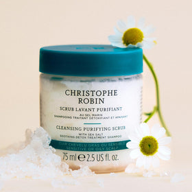Christophe Robin scrub being applied to scalp demonstrating gentle massage and detox