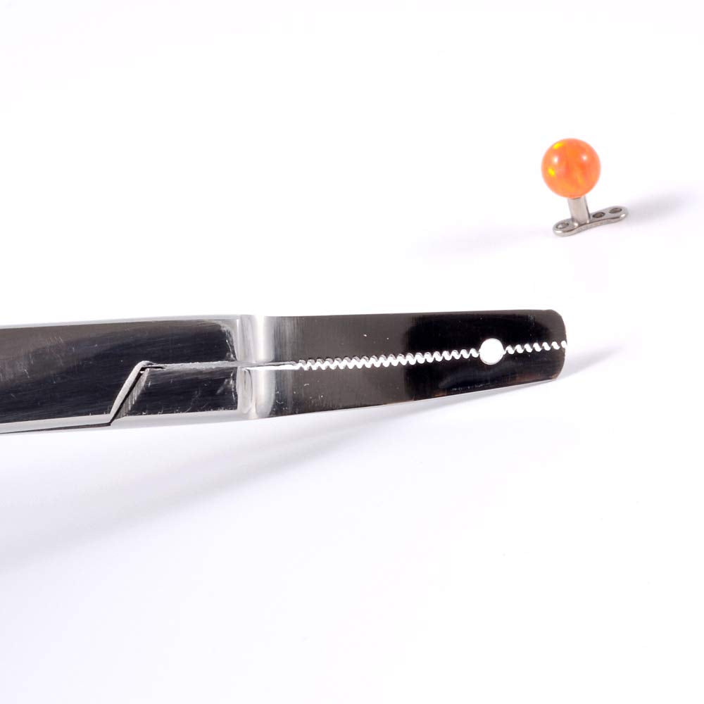 CHUANCI tip detail grasping a microdermal anchor with secure non-crushing hold