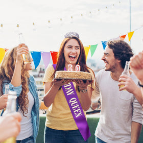 CIEHER sash and crown flatlay with party props conveying cohesive decorative set