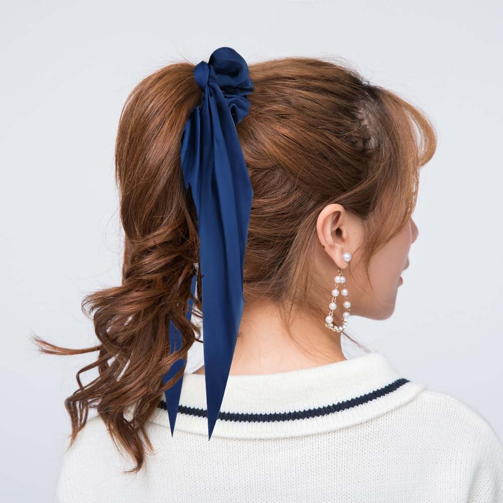Cinaci detachable ribbon tail styled as a small scarf to show accessory versatility