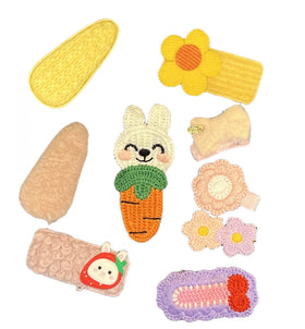 CISMARK child wearing rainbow and fruit hairpins, comfortable secure hold for play