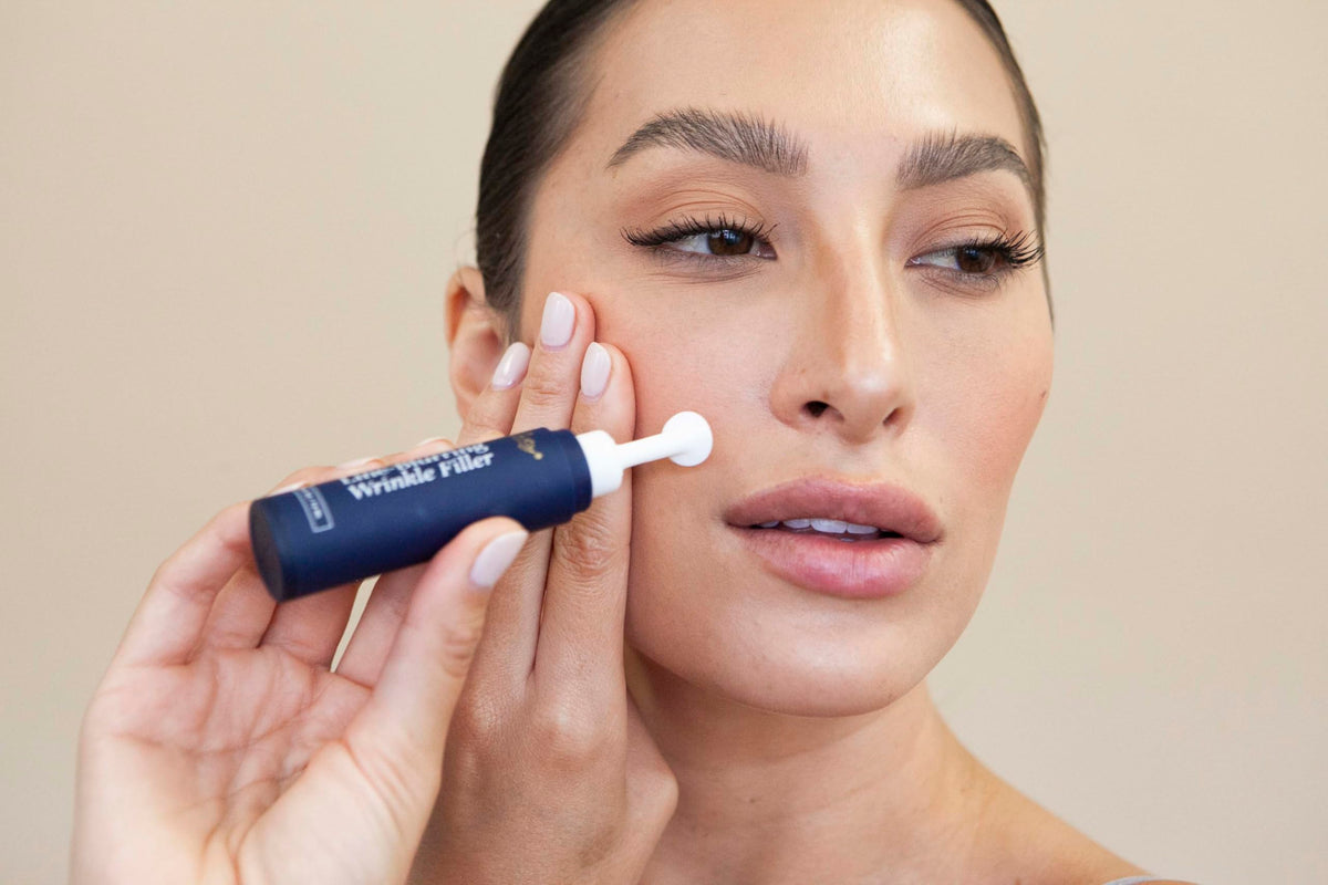 City Beauty applying filler to eye area for immediate smoothing