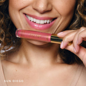 City Beauty City Lips swatches on arm displaying Sun Diego color and buildable coverage