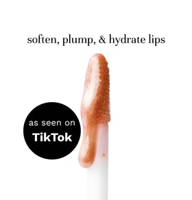 City Beauty gloss held in hand to show actual size and portability