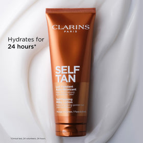 Clarins 4.5 oz bottle beside common items to show size and travel-friendly convenience