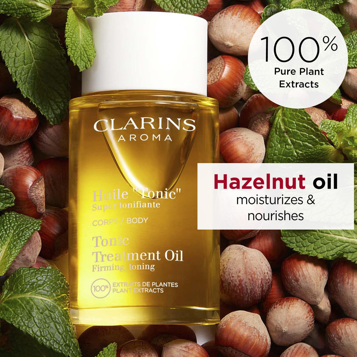 CLARINS oil being applied on skin by hand to show easy massage and hydration benefit